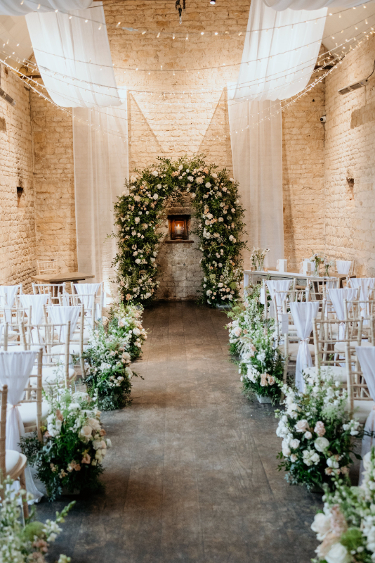 Flower arch for ceremony backdrop at Lapstone House